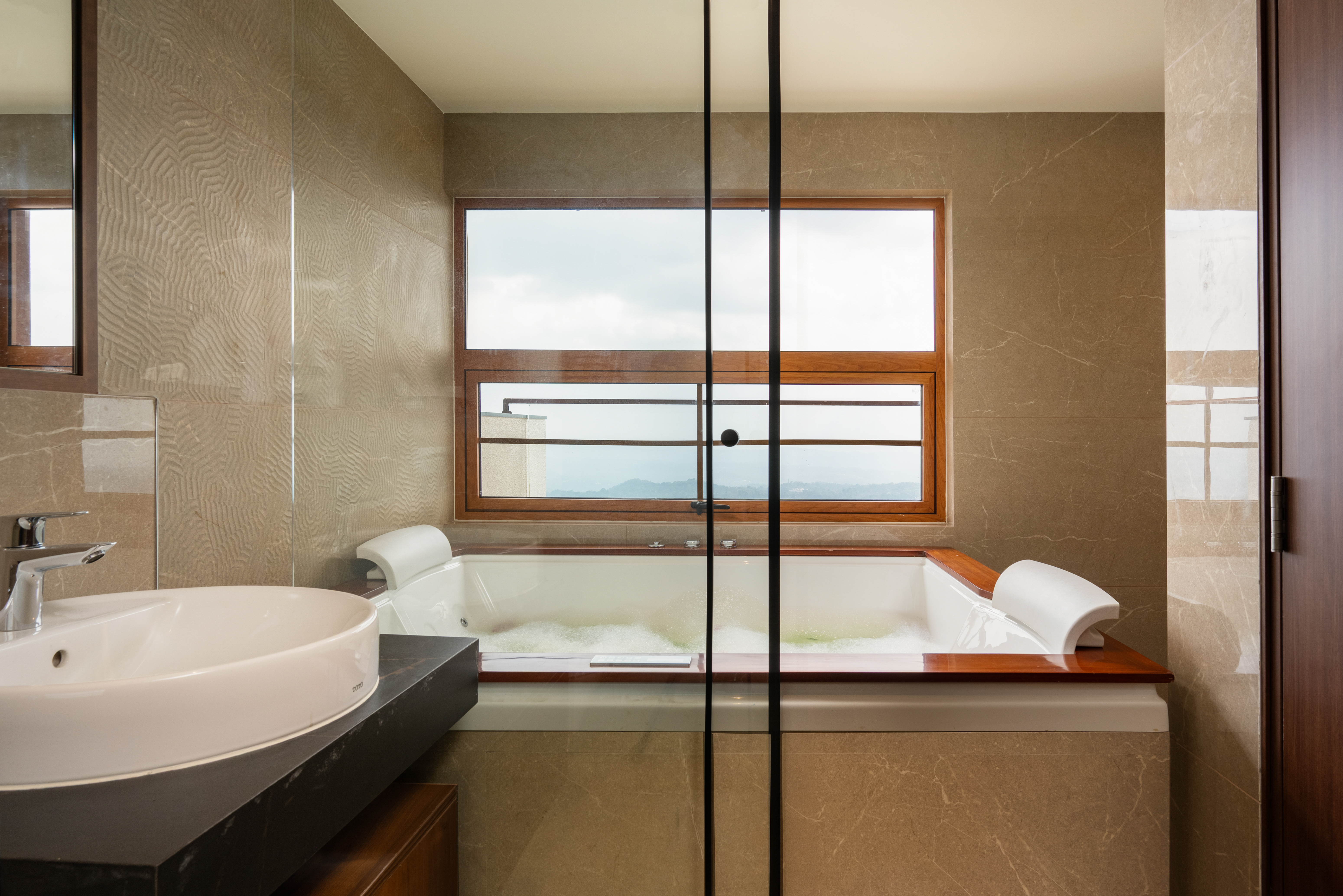 Olive Woods Munnar – misty hill view from resort